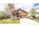 Charming single-Gathering home with well-maintained lawn, two-car garage, and cozy covered porch at 1358 14Th Ave, Longmont, CO 80501