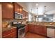 Well-equipped kitchen featuring granite countertops, stainless steel appliances and backsplash at 1358 14Th Ave, Longmont, CO 80501