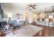 Open-concept living room with hardwood floors, modern furnishings, and plenty of natural light at 1358 14Th Ave, Longmont, CO 80501