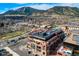 Aerial view of building highlighting rooftop deck and mountain backdrop at 1077 Canyon Blvd # 403, Boulder, CO 80302