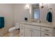 Modern bathroom with white vanity, updated fixtures, and teal towels at 1077 Canyon Blvd # 403, Boulder, CO 80302