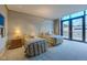 Second bedroom with two twin beds and balcony access at 1077 Canyon Blvd # 403, Boulder, CO 80302
