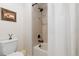 Bathroom with a white shower curtain and tiled shower at 9340 Sori Ln, Highlands Ranch, CO 80126