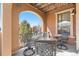 Outdoor patio under a covered archway with furniture, offering a cozy retreat at 9340 Sori Ln, Highlands Ranch, CO 80126