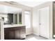 Modern bathroom featuring a vanity, shower, and window offering natural light at 6021 N Boston Ct, Denver, CO 80238