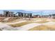 Community park area with modern design elements, a walking path, and neighborhood homes at 6021 N Boston Ct, Denver, CO 80238