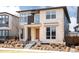 Contemporary two-story home featuring a stone facade, modern windows, and a stylish entrance at 6021 N Boston Ct, Denver, CO 80238