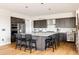 Spacious kitchen island with counter seating, pendant lighting, and stainless steel appliances at 6021 N Boston Ct, Denver, CO 80238