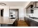 Well-equipped kitchen featuring custom cabinets, sleek countertops, stainless steel appliances, and a modern design at 6021 N Boston Ct, Denver, CO 80238