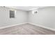 Bedroom with neutral walls, carpeted floors, two windows, and base molding at 2839 Ivanhoe St, Denver, CO 80207