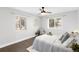 Serene bedroom offers a ceiling fan, lots of natural light, hardwood floors, and cozy decor for relaxation at 2839 Ivanhoe St, Denver, CO 80207