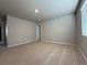 Large bedroom with neutral carpet, good natural light, and an attached closet at 48285 Shetland Dr, Bennett, CO 80102
