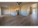 Spacious living room and kitchen area with stainless steel appliances and hardwood flooring at 48285 Shetland Dr, Bennett, CO 80102
