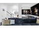 Basement lounge area, complete with wet bar, custom wine storage and comfortable seating at 6103 S Millbrook Ct, Aurora, CO 80016