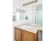 Bathroom vanity with double sinks, a large mirror, and modern fixtures at 6103 S Millbrook Ct, Aurora, CO 80016