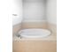 A bright bathroom showcasing a standalone bathtub with tile surround and modern fixtures at 6103 S Millbrook Ct, Aurora, CO 80016