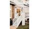 Staircase to the covered deck featuring stone supports and a grill at 6103 S Millbrook Ct, Aurora, CO 80016