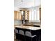 Kitchen featuring granite countertops, wooden cabinets, stainless steel appliances, and modern pendant lighting at 6103 S Millbrook Ct, Aurora, CO 80016