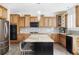 Spacious kitchen with granite countertops, stainless steel appliances, and a stylish island with chairs at 6103 S Millbrook Ct, Aurora, CO 80016