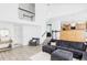 Bright and open living space with a vaulted ceiling, a large sectional, and views of the kitchen at 6103 S Millbrook Ct, Aurora, CO 80016