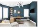 Modern office with stylish light fixture, sleek desk, and ample natural light at 6103 S Millbrook Ct, Aurora, CO 80016
