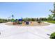 Community playground featuring colorful play structures and swings at 6103 S Millbrook Ct, Aurora, CO 80016