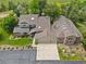 Expansive home featuring a three car garage, skylights, and mature trees at 6895 S Norfolk St, Foxfield, CO 80016