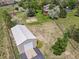 Expansive property featuring a large garage, playground, home with yard, and mature trees at 6895 S Norfolk St, Foxfield, CO 80016