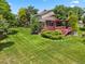 Beautiful backyard featuring a covered deck, well-maintained lawn, and mature landscaping at 6895 S Norfolk St, Foxfield, CO 80016