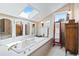 Bathroom featuring a bathtub and natural light at 6895 S Norfolk St, Foxfield, CO 80016
