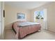 Bedroom with bright neutral walls and a decorative bedspread at 6895 S Norfolk St, Foxfield, CO 80016