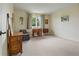 Bedroom with neutral walls, wood furniture, and bright window at 6895 S Norfolk St, Foxfield, CO 80016