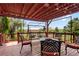 Outdoor deck with a seating area, outdoor swing, and views of the landscape at 6895 S Norfolk St, Foxfield, CO 80016