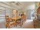 Spacious dining room with built-in bookshelves and access to other rooms at 6895 S Norfolk St, Foxfield, CO 80016