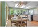 Open kitchen and breakfast nook filled with natural light, featuring a ceiling fan and views of the backyard at 6895 S Norfolk St, Foxfield, CO 80016