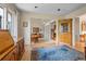 Bright living area featuring hardwood floors and antique furniture at 6895 S Norfolk St, Foxfield, CO 80016