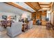 Comfortable living room with hardwood floors, built-in shelving, and a cozy seating area for relaxation at 6895 S Norfolk St, Foxfield, CO 80016