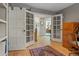 Office space featuring french doors, built-in shelving, and a view of other rooms at 6895 S Norfolk St, Foxfield, CO 80016