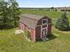 Aerial view of a red outbuilding with white trim at 6895 S Norfolk St, Foxfield, CO 80016