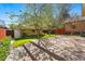 Backyard patio offers ample space for outdoor gatherings and a lovely garden shed at 810 Adams St, Denver, CO 80206