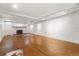 Spacious basement features neutral walls, cork floors, and a charming fireplace at 810 Adams St, Denver, CO 80206