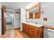 Bathroom featuring double sink vanity, generous storage, and neutral color scheme at 810 Adams St, Denver, CO 80206