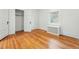 A bright bedroom with hardwood floors and two white doors at 810 Adams St, Denver, CO 80206