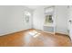 A bright bedroom featuring parquet floors and two large windows at 810 Adams St, Denver, CO 80206