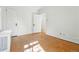A bright bedroom featuring parquet floors, radiator and three doors at 810 Adams St, Denver, CO 80206
