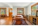 Cozy dining room featuring a wooden table with matching chairs and a decorative rug at 810 Adams St, Denver, CO 80206