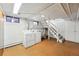 Basement laundry room includes laundry machines, sink, storage, and convenient basement access at 810 Adams St, Denver, CO 80206