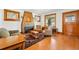 Cozy living room with hardwood floors, area rug, and natural wood trim at 810 Adams St, Denver, CO 80206