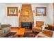 Bright living room with a striking fireplace, hardwood floors, and comfortable seating at 810 Adams St, Denver, CO 80206