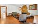 Cozy living room featuring a decorative fireplace, hardwood floors, and natural light at 810 Adams St, Denver, CO 80206